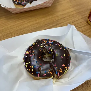 Chocolate frosted donut with sprinkles
