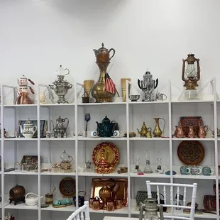 a white table with white chairs