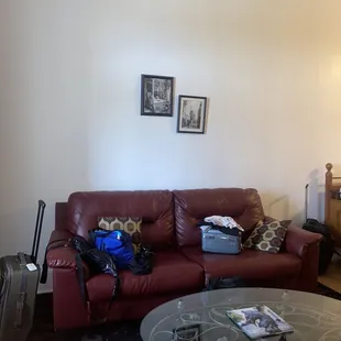 The couch shown was about two times larger than this one and the wall was covered in art and had plants in the room.