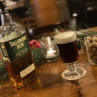 a bottle of tullamore dew and a glass of beer