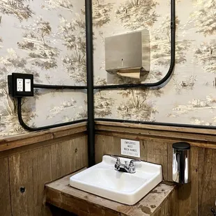 a sink in a rustic bathroom