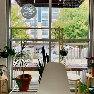 a white chair in front of a window