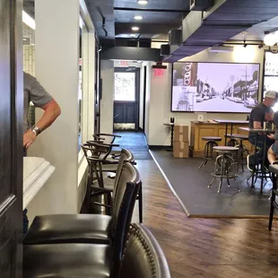 a man standing at a bar