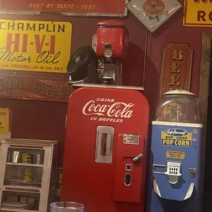 a coca cola machine and a soda dispenser
