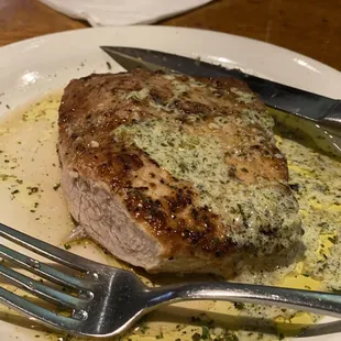 The pork tenderloin in chimichurri sauce. (So juicy on the inside!) Usually a special.
