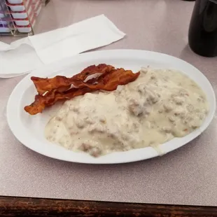 Biscuit and sausage gravy and side of bacon.