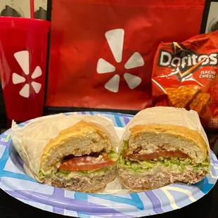 a sandwich and chips on a plate