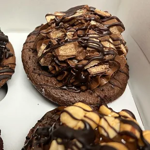 a variety of chocolate covered donuts