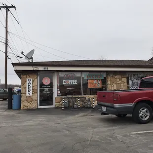 a truck parked in front of a store