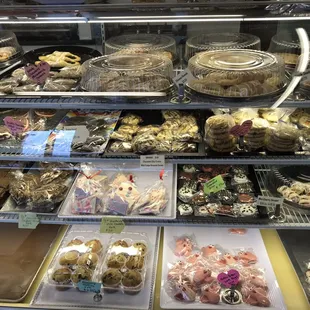 a variety of baked goods in a display case