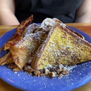 French Toast, ordered with chocolate crunch (chocolate chips and pecans).  Side of bacon.