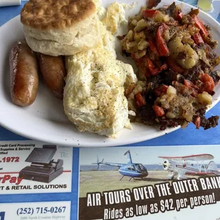 Egg Whites, fried potatos, biscuit and sausage links.