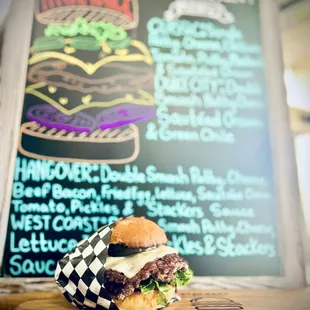 a burger on a wooden board