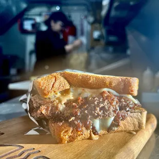 a close up of a sandwich on a cutting board