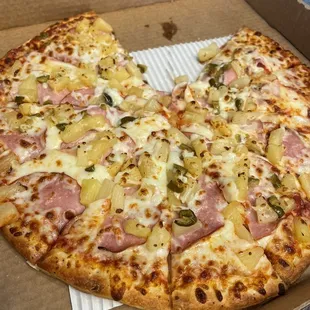 Custom Hawaiian thin crust  pizza with Ham, Pineapple, and Jalapeño pepper!