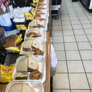 a long table of sandwiches