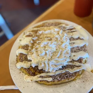 Always November Signature Pancakes!!! Pumpkin flavored batter pancakes with whipped cream and pumpkin spice.