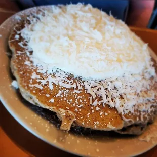 Chocolate pancakes with coconut and whipped topping
