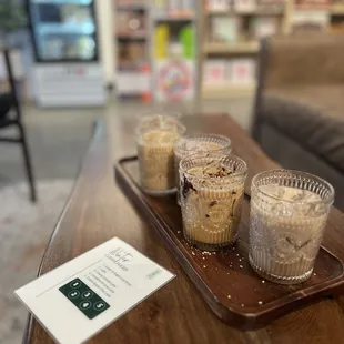 Seasonal coffee flight that included a regular latte, cherry mocha, &amp; campfire s&apos;mores