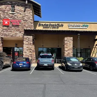 parking lot with cars in front
