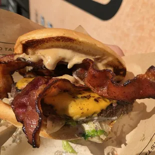 bacon and cheese on a bun