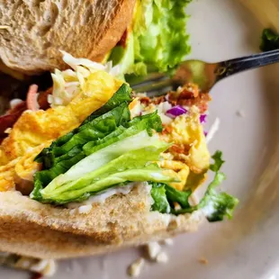 A closer look at my bacon breakfast sandwich. I added Coleslaw to the sandwich ( not sure why) but it was delicious.