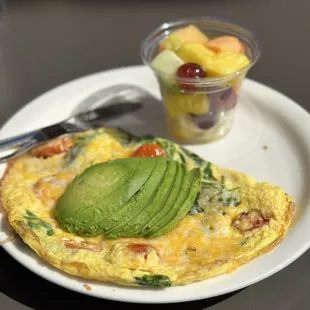 Avocado omelet with fruit. Delicious!