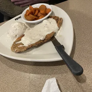 Chicken fried steak with mashed potatoes and carrots
