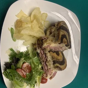 Reuben:  Slow cooked Corned Beef on Marble Rye w/Sauerkraut and Swiss or Provolone