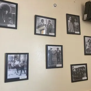 a wall full of framed photos