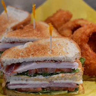 a sandwich and onion rings