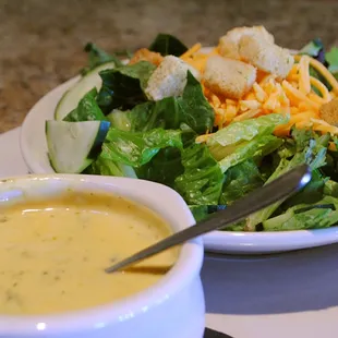 a bowl of soup and a bowl of salad