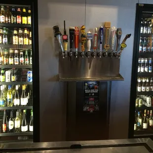 a bar with beer taps on the wall