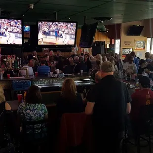 a large group of people watching a baseball game
