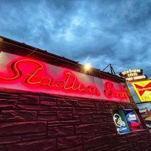 the neon sign for stadium inn
