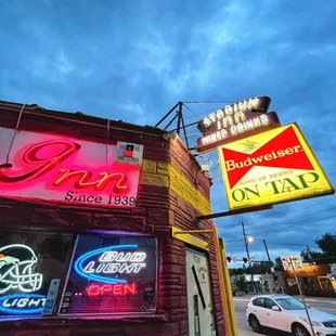 neon signs on the side of a building