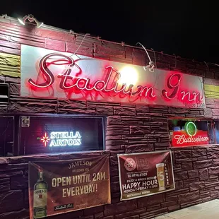 the neon sign for stadium inn