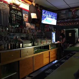a bar with a large screen tv