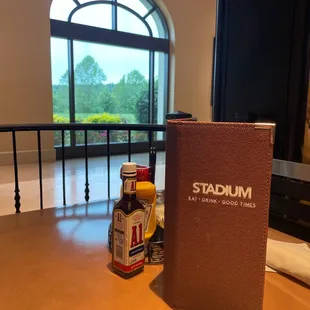 a menu and a bottle of beer