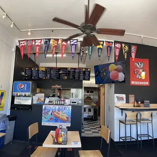 a restaurant with a ceiling fan