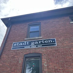 a sign on a brick building