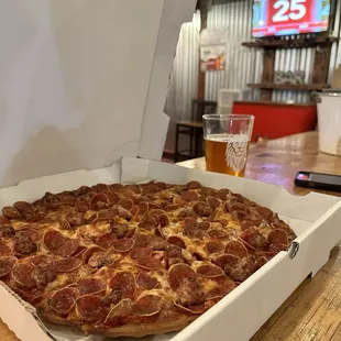 Large pepperoni and sausage pizza