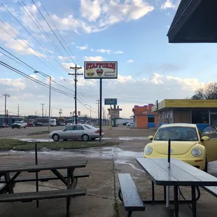 picnic tables and a car