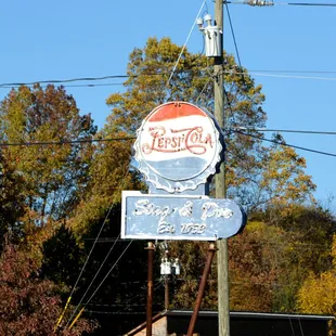 a pepsi cola sign