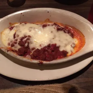 Baked lasagna floating in a bit too much grease.