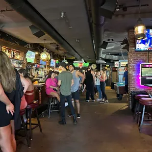a crowd of people at a bar