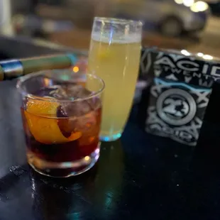 a drink and a cigarette on a table