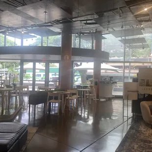 seating area with tables and chairs