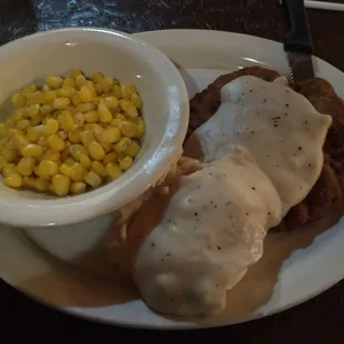 Country fried steak, mashed taters, and corn.