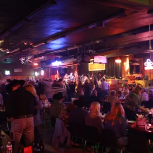 a large group of people sitting at tables